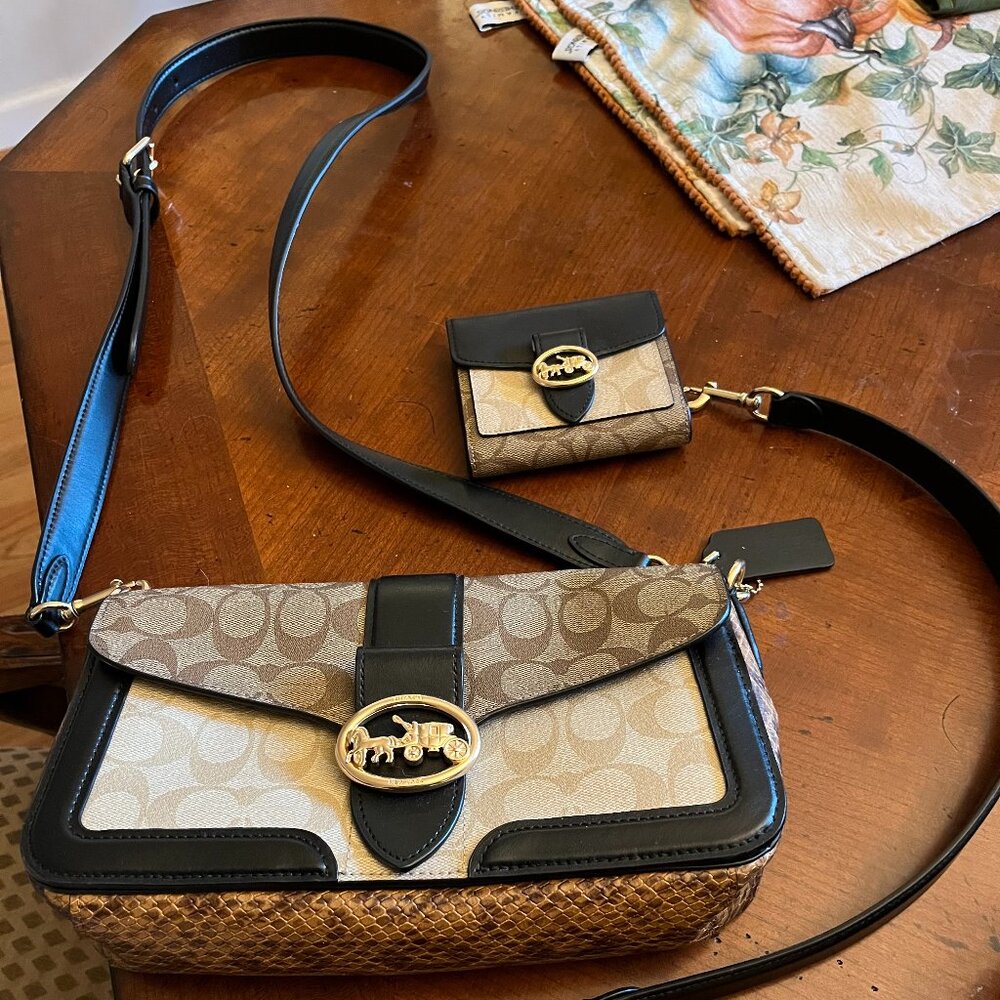New, never worn COACH Black and brown tabby with matching new wallet!